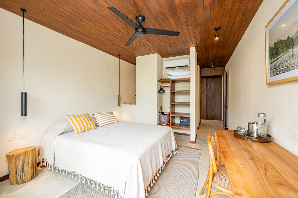 Suite Two — wardrobe wall and bedside detail