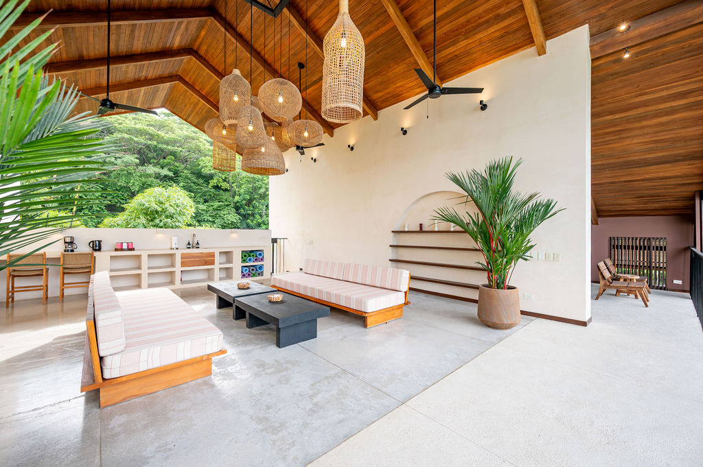 Wide view across the third-floor room toward the open side and the jungle