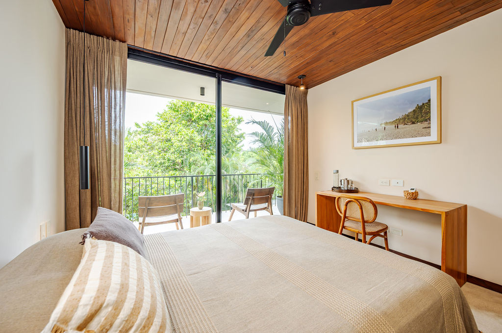Suite Three — built-in desk beside the balcony doors