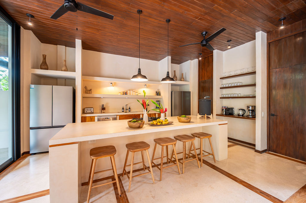 Head-on view of the kitchen counter and teak stools
