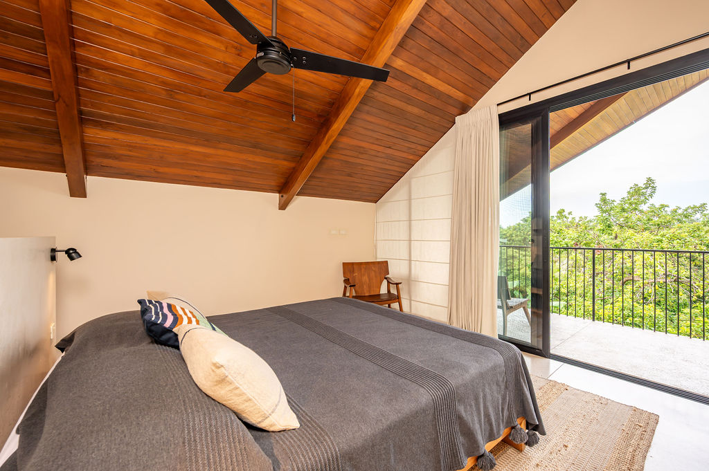 Balcony door of the gable suite open to the treetops